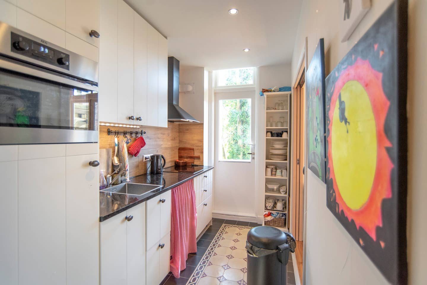 The galley kitchen with garden door